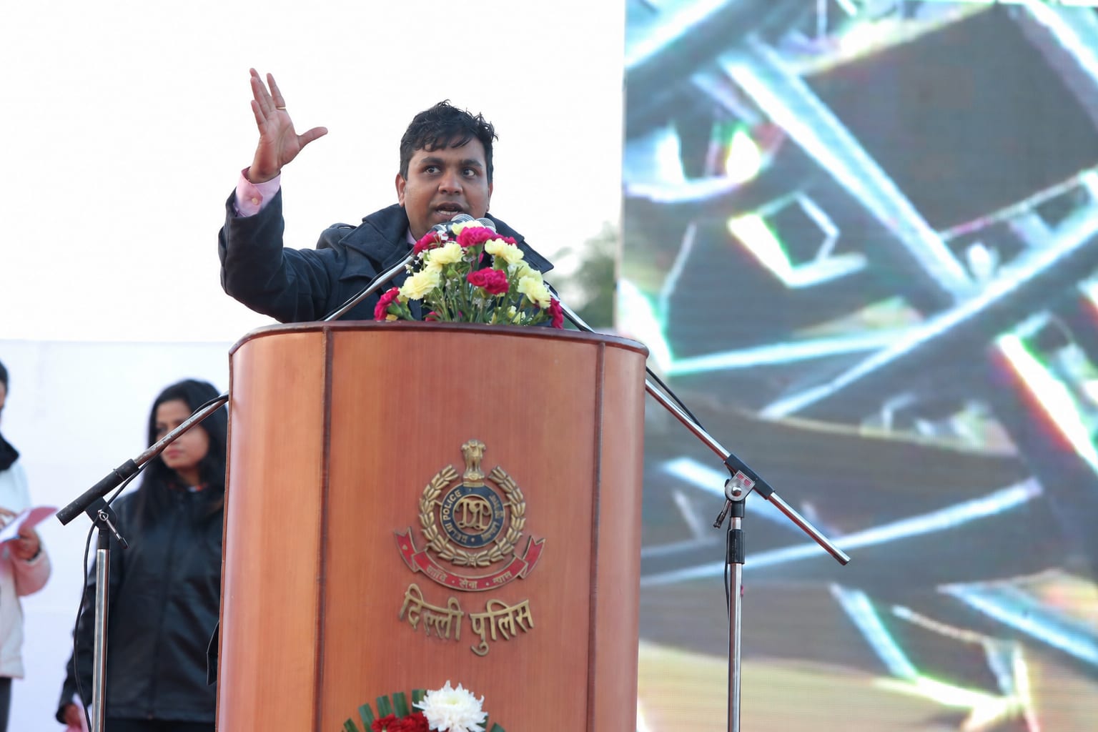 Devendra Kumar addressing a gathering from the podium